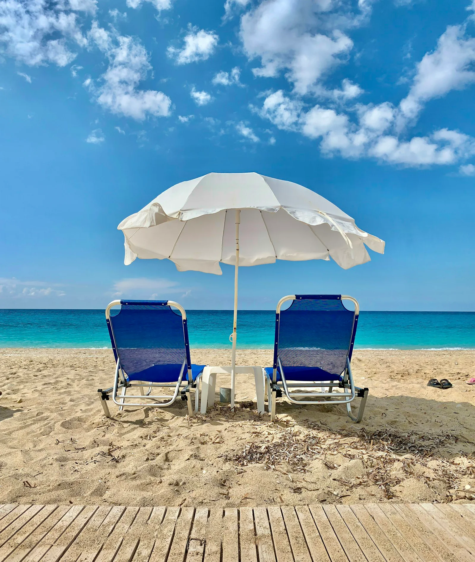 Representative photo of beach shade and chairs set up on the sand